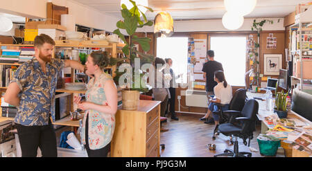 Creative business people talking, working in office Stock Photo
