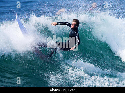 UK Pro male surfers in action sunshine Stock Photo