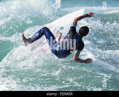 UK Pro male surfers in action sunshine Stock Photo