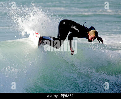 UK Pro male surfers in action sunshine Stock Photo