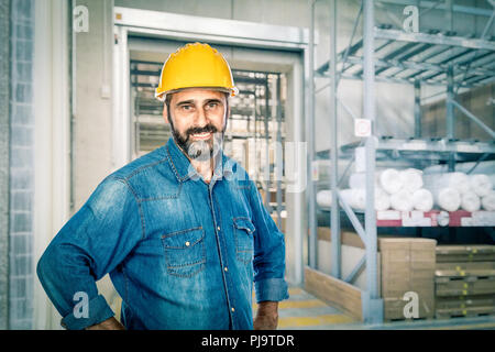 confident handyman wearing yellow helmet Stock Photo