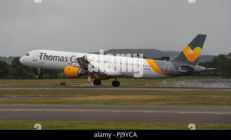 Thomas Cook Airlines Airbus A321 smokes on touch down at Glasgow International Airport, Renfrewshire, Scotland - 14th June 2016 Stock Photo
