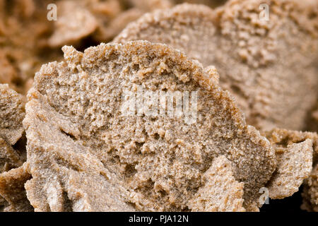Detailed close-up of a pink-red sand rose, showcasing sand grain textures and desert rose structure." Stock Photo