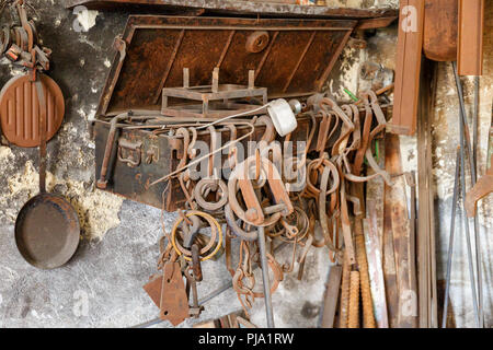 Old forged parts in a workshop Stock Photo