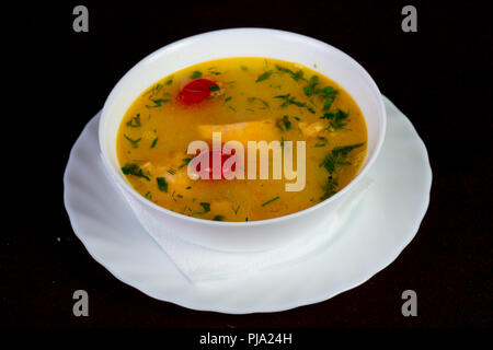 Fish soup with salmon and tomato - Uha Stock Photo