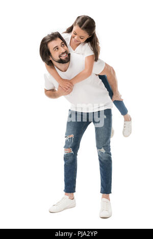 smiling father and little daughter in white shirts piggybacking isolated on white Stock Photo
