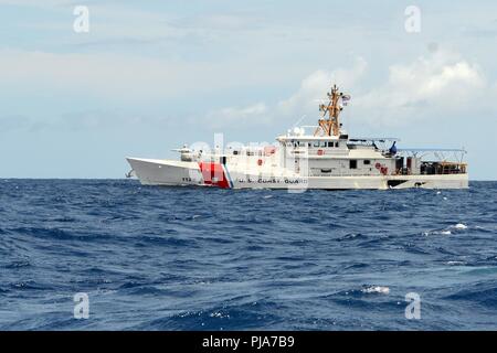 The crew of the U.S. Coast Guard Cutter Joseph Gerczak (WPC 1126) on patrol off the coast of Waikiki, July 4, 2018. The Joseph Gerczak's crew participated in an operation to keep swimmers and boaters safe during a Fourth of July celebration on the waters off Waikiki. (United States Coast Guard Stock Photo