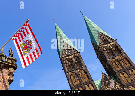 Bremen, Germany - St. Petri cathedral and the Bremen state flag flying from the historic city hall