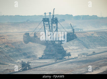 05 September 2018, Germany, Elsdorf: There is a large excavator in the Hambach open-cast lignite mine. In the background is the Hambach Forest. Photo: Christophe Gateau/dpa Stock Photo