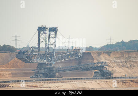 05 September 2018, Germany, Elsdorf: There is a large excavator in the Hambach open-cast lignite mine. In the background is the Hambach Forest. Photo: Christophe Gateau/dpa Stock Photo