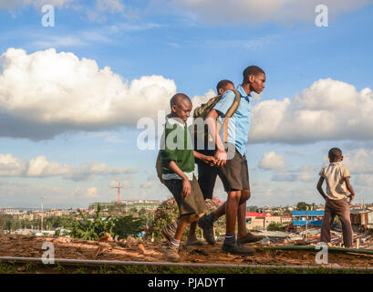 Nairobi, Kenya. 28th Mar, 2018. Boys seen heading back home after school in Kibera.Kibera is one of Africa's largest Slums located in East Africa, Kenya. Credit: Donwilson Odhiambo/SOPA Images/ZUMA Wire/Alamy Live News Stock Photo