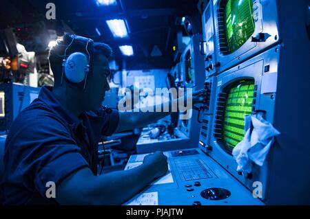 Mediterranean Sea. 4th Sep, 2018. MEDITERRANEAN SEA (Sept. 4, 2018) Sonar Technician (Surface) 3rd Class Angel Navasalazar stands watch in the sonar control room aboard the Arleigh Burke-class guided-missile destroyer USS Carney (DDG 64), Sept. 4, 2018. Carney, forward-deployed to Rota, Spain, is on its fifth patrol in the U.S. 6th Fleet area of operations in support of regional allies and partners as well as U.S. national security interests in Europe and Africa. (U.S. Navy photo by Mass Communication Specialist 1st Class Ryan U. Kledzik/Released)180904-N-UY653-076 US Navy via globalloo Stock Photo