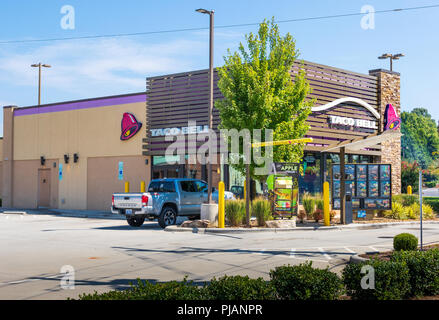 HICKORY, NC, USA-9/2/18: A Taco Bell restaurant in Hickory, NC, showing the drive-thru, and one pickup truck parked in lot. No people are visible. Stock Photo