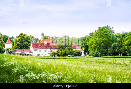 View on blooming flower in front of castle Blutenburg in Munich - Germany Stock Photo