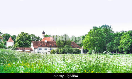View on blooming flower in front of castle Blutenburg in Munich - Germany Stock Photo