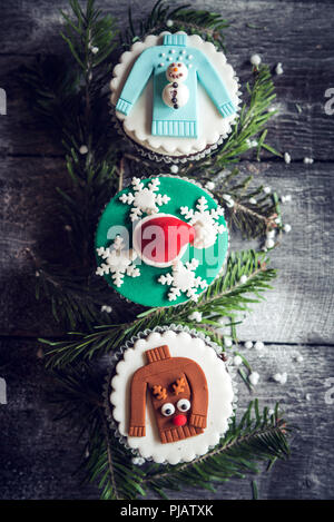 Christmas cupcakes on the wooden background Stock Photo