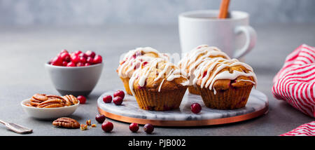 Muffins, cakes with cranberry and pecan nuts. Christmas decoration. Stock Photo