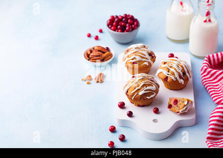 Muffins, cakes with cranberry and pecan nuts. Christmas decoration. Copy space. Stock Photo