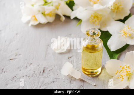 Jasmine oil. Aromatherapy with Jasmine oil and soap. Jasmine flower. Stock Photo