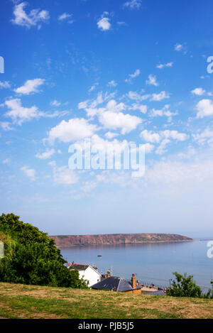 Cumulus clouds above Filey Brigg on a warm sunny day in August, Filey, North Yorkshire, UK Stock Photo