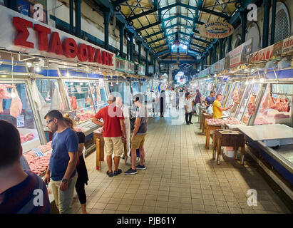 Athens, Greece - July 2, 2018. Costumers buying meat in Varvakios, Central Market of Athens. Attica region, Greece. Stock Photo