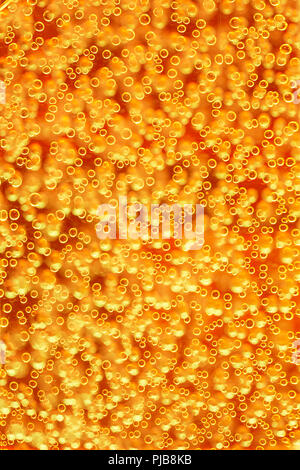 Highly detailed texture of gaseous liquid with sparkling yellow bubbles Stock Photo