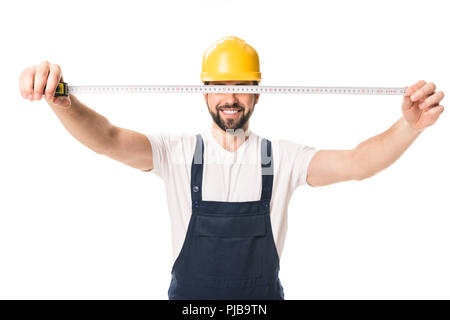 handsome happy workman holding measuring tape isolated on white Stock Photo