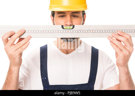 handsome construction worker in hard hat holding level tool isolated on white Stock Photo