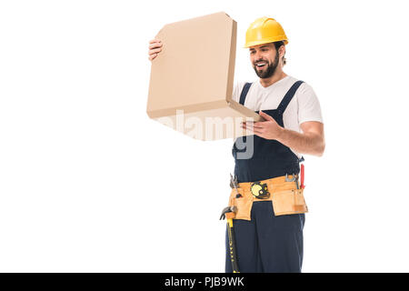 happy workman in hard hat and tool belt opening pizza box isolated on white Stock Photo