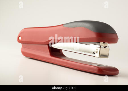 new stapler for stapling papers on a table Stock Photo