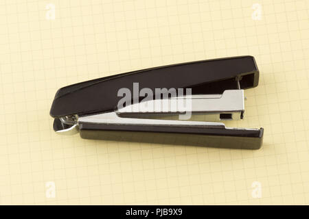 new stapler for stapling papers on a table Stock Photo