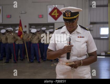 U.S. Navy Lt. Netetia K. Walker gives the invocation at the 6th Marine Corps District (MCD) change of command ceremony at Parris Island, South Carolina, July 2, 2018. During the ceremony, Col. Jeffrey C. Smitherman, the outgoing Commanding Officer of 6th MCD, relinquished his command to Col. William C. Gray. Stock Photo