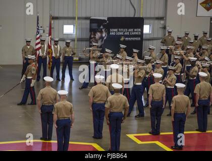 U.S. Marines with the Parris Island Marine Band participate in the 6th Marine Corps District (MCD) change of command ceremony at Parris Island, South Carolina, July 2, 2018. During the ceremony, Col. Jeffrey C. Smitherman, the outgoing Commanding Officer of 6th MCD, relinquished his command to Col. William C. Gray. Stock Photo