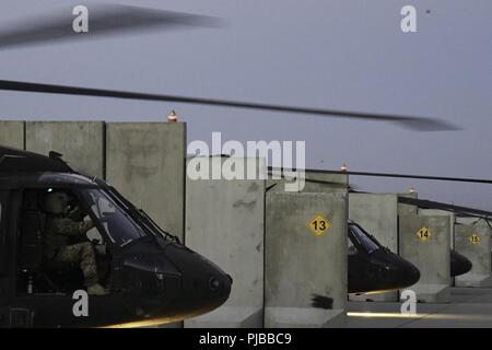 A UH-60 Blackhawk helicopter assigned to Task Force Shadow conducts a pre flight run-up and health indicator test to validate engine performance at Bagram Airfield, July 2. Stock Photo