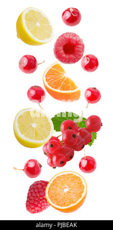 Flying fruits. Falling orange and red barries isolated on white background with clipping path as package design element and advertising. Floating frui Stock Photo