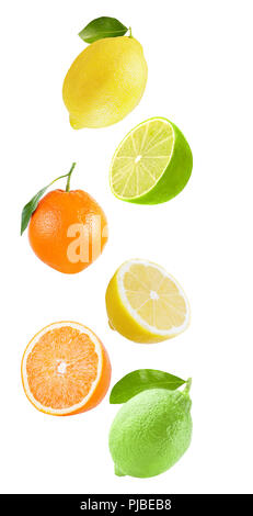 Flying fruits. Falling fresh citrius (lemon, orange, lime) isolated on white background with clipping path as package design element and advertising.  Stock Photo