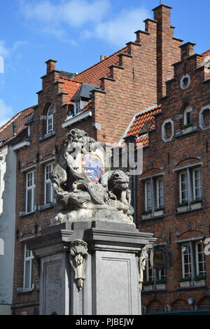The Arms of the town Bruge. Sculpture with lion and bear in Bruges, Belgium Stock Photo