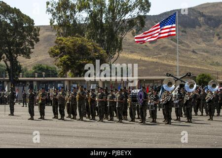 1st Marine Division band plays during a change of command ceremony held at Marine Corps Base Camp Pendleton, Calif., July 11, 2018. The ceremony marks the change in leadership and a continuation of the unit's constant preparedness for the security of the nation. Stock Photo