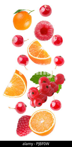 Flying fruits. Falling orange and red barries isolated on white background with clipping path as package design element and advertising. Floating frui Stock Photo