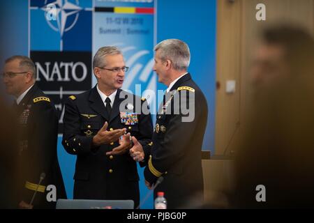 General Denis Mercier, Supreme Allied Commander Transformation, chats with General John W.  Nicholson Jr., Resolute Support Mission commander, during the Brussels Summit at NATO HQ, Brussels, July 12, 2018. (NATO Stock Photo