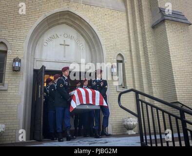 The casket of retired 1st Sgt. Harold Eatman is carried by paratroopers of the 2nd Battalion, 505th Parachute Infantry Regiment from the Cathedral of Saint Patrick in Charlotte, North Carolina after his funeral July 11, 2018.  Eatman was a member of the 82nd Airborne Division’s 505th PIR and conducted combat jumps into Sicily, Salerno, Normandy and Holland during World War II. Stock Photo