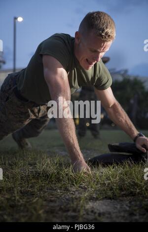 Capt. Clay Groover trains during a High Intensity Tactical Training class aboard Marine Corps Air Station Beaufort July 12.  The class was led by Sgt. Jared Skelley, Force Fitness instructor with Headquarters and Headquarters Squadron. Groover is with Headquarters and Headquarters Squadron. Stock Photo