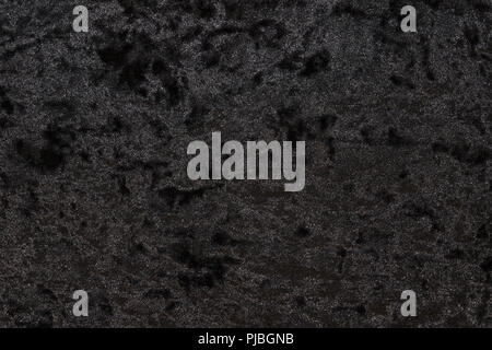 Luxurious feel of a black or dark gray velour cloth enhanced by its highly detailed texture background, featuring a lush and plush surface Stock Photo