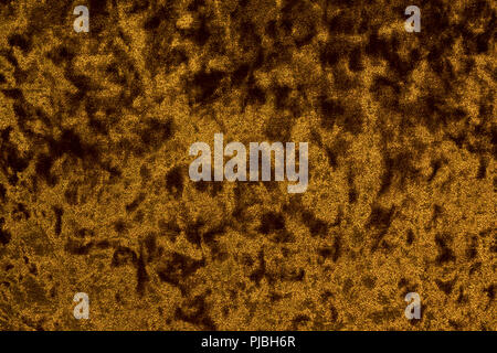 Velour cloth of a golden or brown hue boasting a background with a highly intricate texture distinguished by its opulent surface consisting of intrica Stock Photo