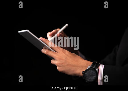 businessman using tablet smartphone for working in the office Stock Photo