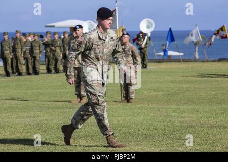 TORII STATION, OKINAWA, Japan – Maj. Travis J. Bassett marches during the 10th Support Group (Regional) Change of command ceremony July 13 on Torii Station, Okinawa, Japan. Maj. Bassett Col. Theodore O. White relieved Col. Derek K. Jansen as commanding officer of 10th SG(R). Jansen was the commanding officer for two years. Stock Photo