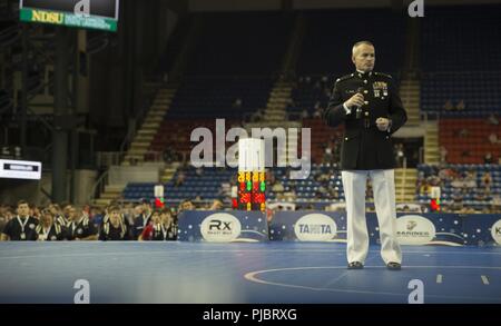 Col. David Fallon, commanding officer of 9th MCD, gives a speech about the dedication need to be a wrestler during the 2018 U.S. Marine Corps Freestyle Finals in Fargo, North Dakota, July 15. The Freestyle Finals feature more than 30 top-level athletes from across the country. Wrestlers share many of the same values as those exhibited by Marines, so the Marine Corps Recruiting Command developed a national-level wrestling marketing relationship to engage the USMC’s target audience and their influencers. Stock Photo