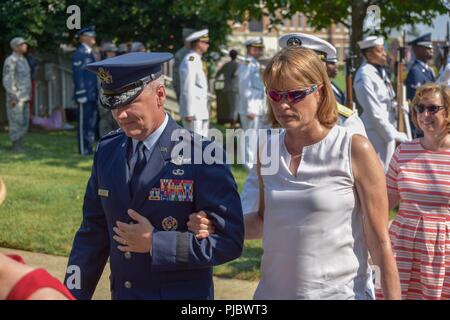 Air Force District of washington Commander Maj. Gen. James A. Jacobson and his wife Nancy depart Joint Base Anacostia-Bolling following a formal parade at the base, which celebrated its 100 Anniversary Jul 3, 2018. Bolling Field was officially dedicated on 1 July, 1918, after the property was purchased by the War Department and turned over to the Aviation Section of the Signal Corps to serve as the primary aviation facility for the capital city. This new military property was appropriately named for Colonel Raynal C. Bolling, an early vanguard in the quest for Army airmanship. Stock Photo