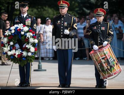 Members of the 3rd Infantry Regiment and the U.S. Army Band (Pershing's Own) stage themselves before a Wreath Laying Ceremony at the Tomb of the Unknown Soldier in Arlington National Cemetery, Arlington, Va.; July 16, 2018. Croatian Command Sgt. Maj. Davor Petek, Command Senior Enlisted Leader for Allied Command Operations at NATO’s Supreme Headquarters Allied Powers Europe,  placed a wreath at the tomb to pay tribute to U.S. Service Members for their contributions to NATO missions, both past and present. Stock Photo