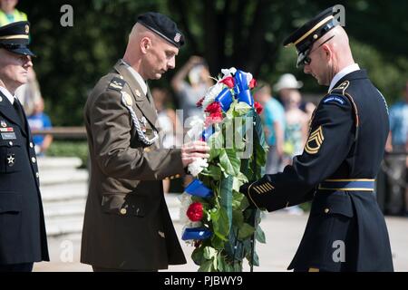 Croatian Command Sgt. Maj. Davor Petek, Command Senior Enlisted Leader for Allied Command Operations at NATO’s Supreme Headquarters Allied Powers Europe, places a wreath at the Tomb of the Unknown Soldier in Arlington National Cemetery, Arlington, Va.; July 16, 2018. Command Sgt. Maj. Petek placed a wreath at the tomb to pay tribute to U.S. Service Members for their contributions to NATO missions, both past and present. Stock Photo